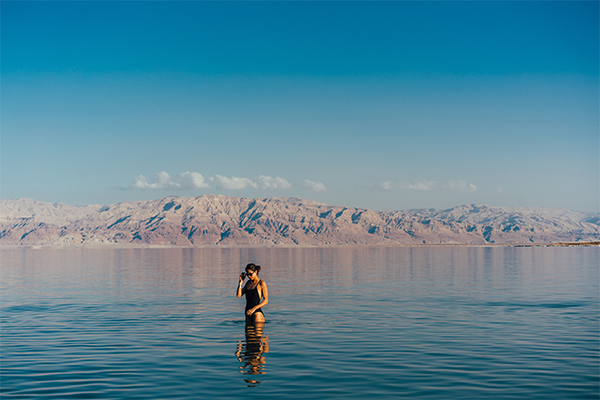 young woman going to dead sea israel